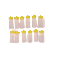 1 inch Mini Plastic Baby Milk Bottle Yellow Caps 144 Pieces